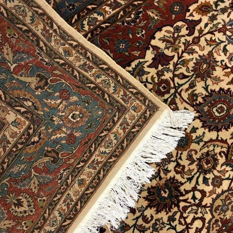 What is difference between a rug and a carpet?